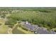 Aerial view featuring townhouse exteriors bordered by a pond, trees, and a golf course at 18236 Paradise Point Dr, Tampa, FL 33647