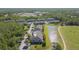 An aerial view of a complex nestled among lush trees, ponds, and golf course at 18236 Paradise Point Dr, Tampa, FL 33647