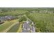 Birds-eye view showcasing townhouses, a golf course, a picturesque pond and lush landscaping at 18236 Paradise Point Dr, Tampa, FL 33647