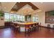 The community bar offers a large wrap around bar, wood floors, and golf course views at 18236 Paradise Point Dr, Tampa, FL 33647
