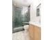 Elegant bathroom features tiled shower with glass doors and stylish vanity at 18236 Paradise Point Dr, Tampa, FL 33647