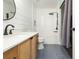 Modern bathroom features sleek vanity, soaking tub, and stylish tile at 18236 Paradise Point Dr, Tampa, FL 33647