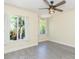 Cozy bedroom with hardwood floors, ceiling fan, and natural lighting at 18236 Paradise Point Dr, Tampa, FL 33647