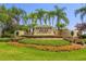 Inviting entrance to Heritage Isles Golf & Country Club with lush landscaping and clear signage at 18236 Paradise Point Dr, Tampa, FL 33647