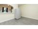 Dining room featuring modern floors and large storage, plus view of the kitchen at 18236 Paradise Point Dr, Tampa, FL 33647