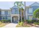 Inviting condo exterior features a private balcony, manicured hedges, and a well-maintained walkway at 18236 Paradise Point Dr, Tampa, FL 33647
