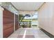 Relaxing screened patio with tile flooring, lighting, and beautiful water view at 18236 Paradise Point Dr, Tampa, FL 33647
