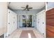 Cozy screened patio featuring tile floors, storage, and views of the lush surroundings at 18236 Paradise Point Dr, Tampa, FL 33647