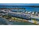 An aerial view of the condos highlighting the pool, private marina, and waterfront location at 1847 Shore S Dr # 507, South Pasadena, FL 33707
