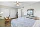 Cozy bedroom featuring neutral walls, a ceiling fan, multiple closets, and wood-look flooring at 1847 Shore S Dr # 507, South Pasadena, FL 33707