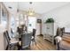 Cozy dining area featuring a glass table, wicker chairs, and a decorative pendant light fixture at 1847 Shore S Dr # 507, South Pasadena, FL 33707