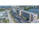 Aerial view of condo building and parking lot, close to city and water at 1847 Shore S Dr # 507, South Pasadena, FL 33707