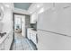 Well-maintained kitchen with white cabinets, modern appliances, and a tiled floor at 1847 Shore S Dr # 507, South Pasadena, FL 33707
