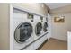 Clean, well-maintained laundry machines available for resident use in a shared laundry room at 1847 Shore S Dr # 507, South Pasadena, FL 33707