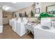 On-site laundry room area with multiple washing machines for residents' convenience at 1847 Shore S Dr # 507, South Pasadena, FL 33707