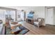 Cozy living room with wicker furniture and a view from the open balcony at 1847 Shore S Dr # 507, South Pasadena, FL 33707
