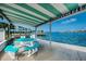 Waterfront outdoor pavilion with picnic tables, BBQ grills, and beautiful ocean views, ideal for relaxed gatherings at 1847 Shore S Dr # 507, South Pasadena, FL 33707