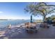 A waterfront picnic area with tables, benches, shade and a picturesque bay view at 1847 Shore S Dr # 507, South Pasadena, FL 33707