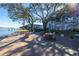 Outdoor picnic area with picnic tables, umbrellas and views of the waterfront at 1847 Shore S Dr # 507, South Pasadena, FL 33707