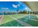 Community shuffleboard court is available for all residents to enjoy, waterfront views in the background at 1847 Shore S Dr # 507, South Pasadena, FL 33707