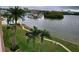 Relaxing water view from the condo with mature palm trees, walking path, and marina at 1847 Shore S Dr # 507, South Pasadena, FL 33707