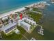 Stunning aerial view of a beachfront condo complex with a marina and gulf views at 19531 Gulf Blvd # 210, Indian Shores, FL 33785