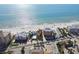 Aerial view of the coastline showing buildings near the ocean and beach access at 19531 Gulf Blvd # 210, Indian Shores, FL 33785