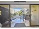 Balcony featuring full patio set and view of the community pool at 19531 Gulf Blvd # 210, Indian Shores, FL 33785