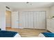 Bedroom with full closet and dresser featuring modern and beach-house decor at 19531 Gulf Blvd # 210, Indian Shores, FL 33785