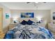 Bright bedroom featuring a comfortable bed and ample dresser space at 19531 Gulf Blvd # 210, Indian Shores, FL 33785