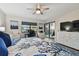 Airy bedroom with a ceiling fan, comfortable bed, and sliding door access to the balcony at 19531 Gulf Blvd # 210, Indian Shores, FL 33785