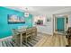 Dining area with seating for six and a view into the updated kitchen at 19531 Gulf Blvd # 210, Indian Shores, FL 33785
