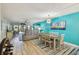 Open concept living and dining area with access to a balcony and views at 19531 Gulf Blvd # 210, Indian Shores, FL 33785