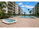 Community pool featuring a hot tub and lounging chairs at 19531 Gulf Blvd # 210, Indian Shores, FL 33785
