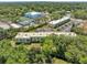 An aerial view of a multi-unit complex showcasing its proximity to community amenities and ample parking at 2005 Greenbriar Blvd # 7, Clearwater, FL 33763