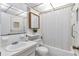 Clean bathroom featuring a shower with curtain and decor at 2005 Greenbriar Blvd # 7, Clearwater, FL 33763