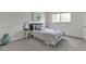 Light and airy bedroom with a comfortable bed, carpet and a large window at 2005 Greenbriar Blvd # 7, Clearwater, FL 33763