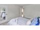 Bright bedroom featuring a mirror and view to the next room at 2005 Greenbriar Blvd # 7, Clearwater, FL 33763