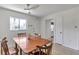 Sunlit dining area featuring a wood table and four chairs adjacent to the kitchen at 2005 Greenbriar Blvd # 7, Clearwater, FL 33763