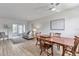 Open-concept floorplan of the living and dining spaces with natural light at 2005 Greenbriar Blvd # 7, Clearwater, FL 33763