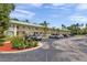 Exterior view of the condo building and parking lot at 2005 Greenbriar Blvd # 7, Clearwater, FL 33763
