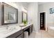 Bathroom features double sinks, a large mirror, and a tiled floor and drawers for storage at 20403 Walnut Grove Ln, Tampa, FL 33647