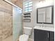 Modern bathroom featuring a glass-enclosed shower, sleek vanity, and contemporary fixtures and lots of light at 20403 Walnut Grove Ln, Tampa, FL 33647