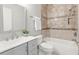 Modern bathroom featuring a tiled shower/tub and sleek vanity at 20403 Walnut Grove Ln, Tampa, FL 33647