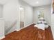 Bedroom with wood floors and a view into another room at 20403 Walnut Grove Ln, Tampa, FL 33647