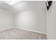 Empty bedroom with neutral carpet and an angled ceiling at 20403 Walnut Grove Ln, Tampa, FL 33647
