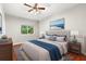 Comfortable bedroom with hardwood floors, natural light, and neutral decor at 20403 Walnut Grove Ln, Tampa, FL 33647