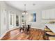 Cozy dining area with hardwood floors and French doors leading to the outdoor patio at 20403 Walnut Grove Ln, Tampa, FL 33647