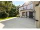 Charming two-story home featuring a spacious driveway and well-manicured lawn and mature shrubs at 20403 Walnut Grove Ln, Tampa, FL 33647
