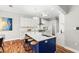 Modern kitchen featuring a large center island with seating, stainless appliances, and open floor plan at 20403 Walnut Grove Ln, Tampa, FL 33647